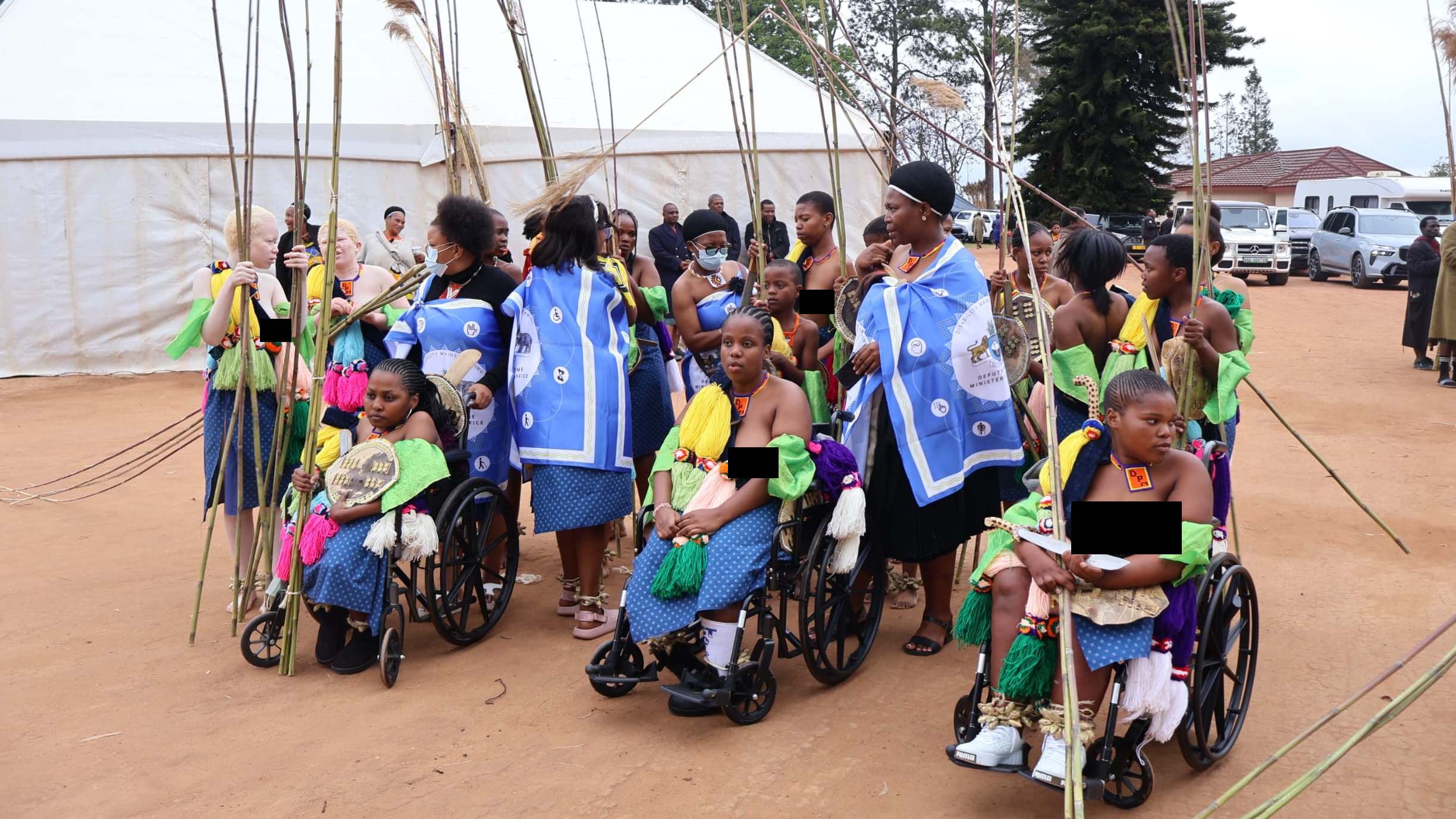 Imbali with disabilities before delivering reed at the Mbangweni Royal Residence, being assisted by officials from the DPM’s Office.